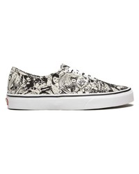 Baskets basses en toile noires et blanches Vans