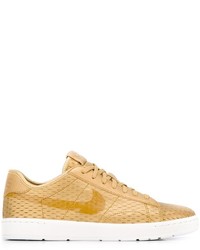 Baskets en cuir dorées Nike