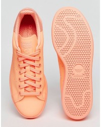 Baskets en cuir orange adidas