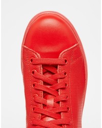 Baskets en cuir rouges adidas