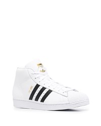 Baskets montantes en cuir blanches et noires adidas