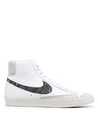 Baskets montantes en cuir blanches et noires Nike