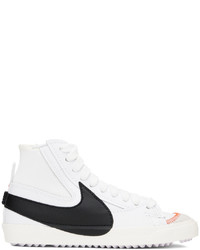 Baskets montantes en cuir blanches et noires Nike