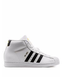 Baskets montantes en cuir blanches et noires adidas