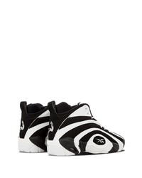 Baskets montantes en cuir blanches et noires Reebok