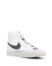 Baskets montantes en cuir blanches et noires Nike