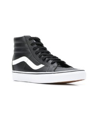 Baskets montantes en cuir noires et blanches Vans