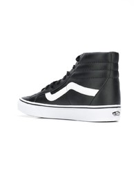 Baskets montantes en cuir noires et blanches Vans