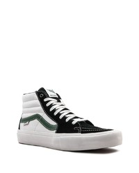 Baskets montantes en toile blanches et noires Vans