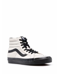 Baskets montantes en toile blanches et noires Vans