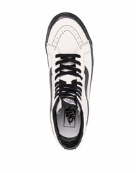 Baskets montantes en toile blanches et noires Vans