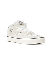 Baskets montantes en toile blanches Vans