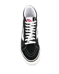 Baskets montantes en toile noires et blanches Vans