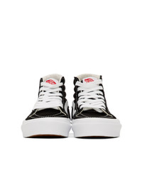 Baskets montantes en toile noires et blanches Vans