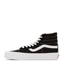 Baskets montantes en toile noires et blanches Vans