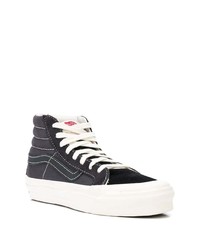 Baskets montantes en toile noires et blanches Vans