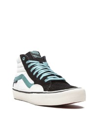 Baskets montantes en toile noires et blanches Vans