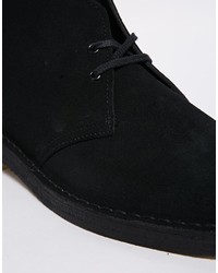 Bottines chukka en daim noires Clarks