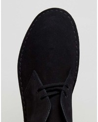 Bottines chukka en daim noires Clarks