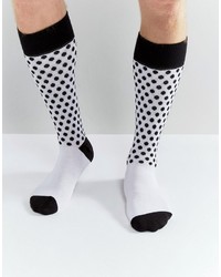 Chaussettes á pois blanches