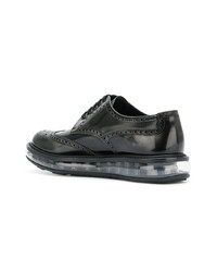 Chaussures brogues en cuir noires Prada