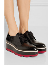 Chaussures brogues en cuir noires Prada