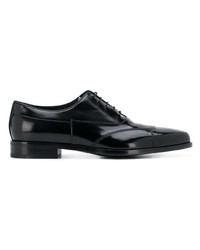Chaussures brogues en cuir noires Prada
