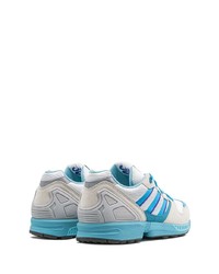 Chaussures de sport blanc et bleu adidas