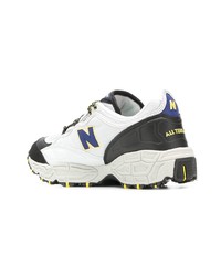 Chaussures de sport blanches et noires New Balance