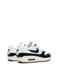 Chaussures de sport blanches et noires Nike