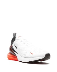 Chaussures de sport blanches et noires Nike