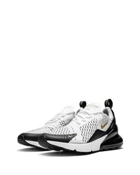 Chaussures de sport blanches et noires Nike