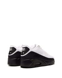 Chaussures de sport blanches et noires Nike