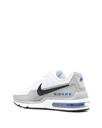 Chaussures de sport blanches et noires Nike