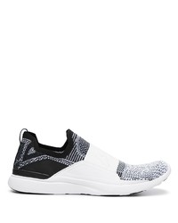 Chaussures de sport blanches et noires APL Athletic Propulsion Labs