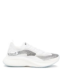 Chaussures de sport blanches et noires APL Athletic Propulsion Labs