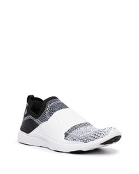 Chaussures de sport blanches et noires APL Athletic Propulsion Labs