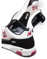 Chaussures de sport blanches et noires New Balance