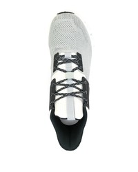 Chaussures de sport blanches et noires ON Running