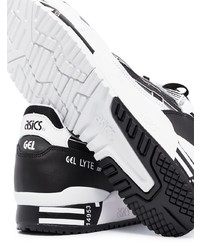 Chaussures de sport blanches et noires Asics