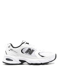 Chaussures de sport blanches et noires New Balance