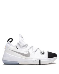 Chaussures de sport blanches et noires Nike