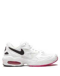 Chaussures de sport blanches et noires Nike