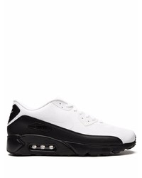 Chaussures de sport blanches et noires Nike