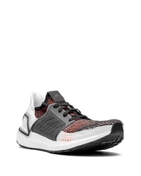 Chaussures de sport blanches et noires adidas