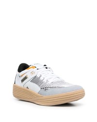 Chaussures de sport blanches et noires Puma