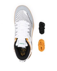 Chaussures de sport blanches et noires Puma