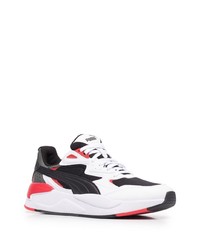 Chaussures de sport blanches et noires Puma