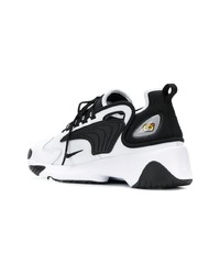 Chaussures de sport blanches et noires Nike