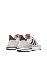 Chaussures de sport blanches et noires adidas